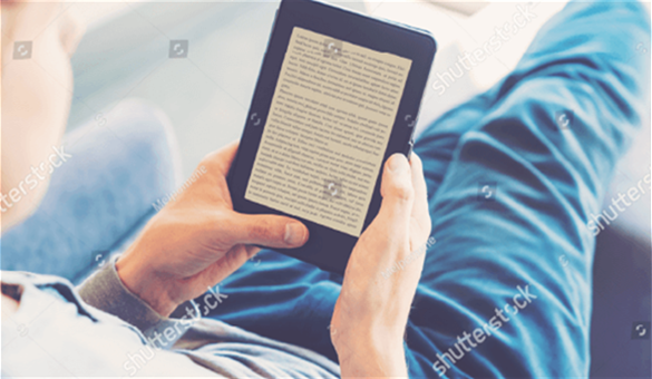 A boy is reading a learning pad