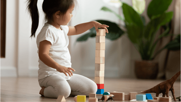 A child is building with blocks