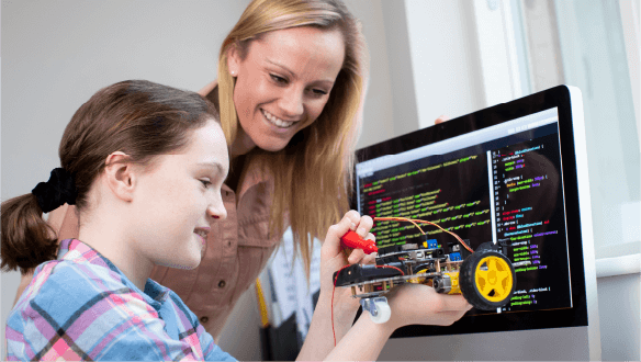 A student accompany by a teacher, engaged in MCE project-based STEAM learning activity